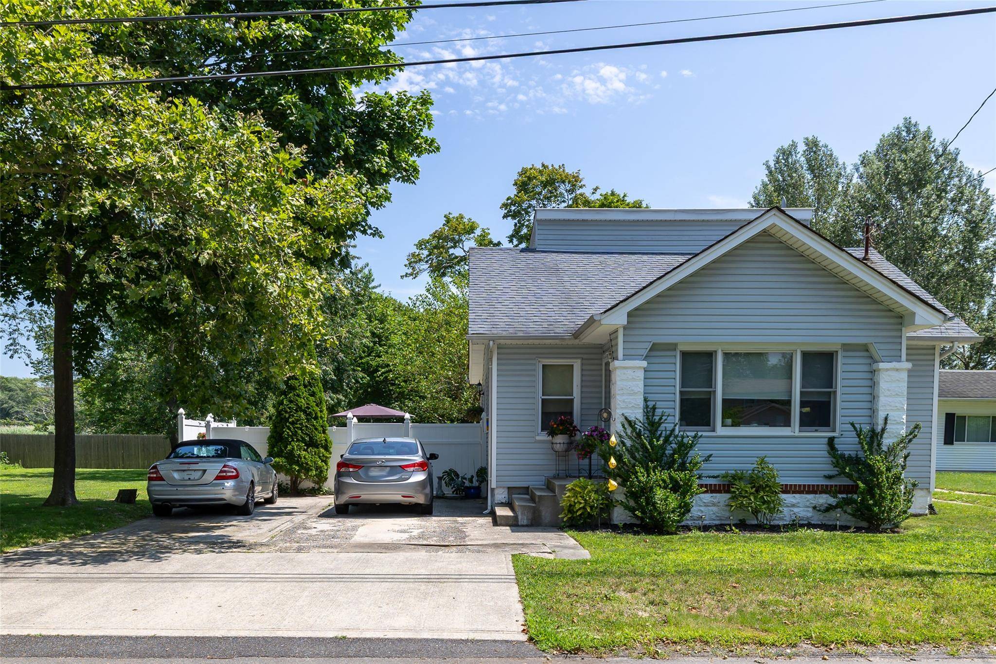 Don't miss this rare opportunity to own a legal 2 family property in the heart of East Patchogue, featuring two separate houses on one lot great opportunity for investors or ...