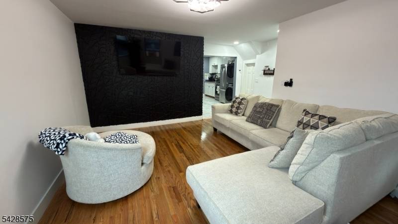 Picture a beautifully fully renovated two family home that blends modern comfort with practical versatility.