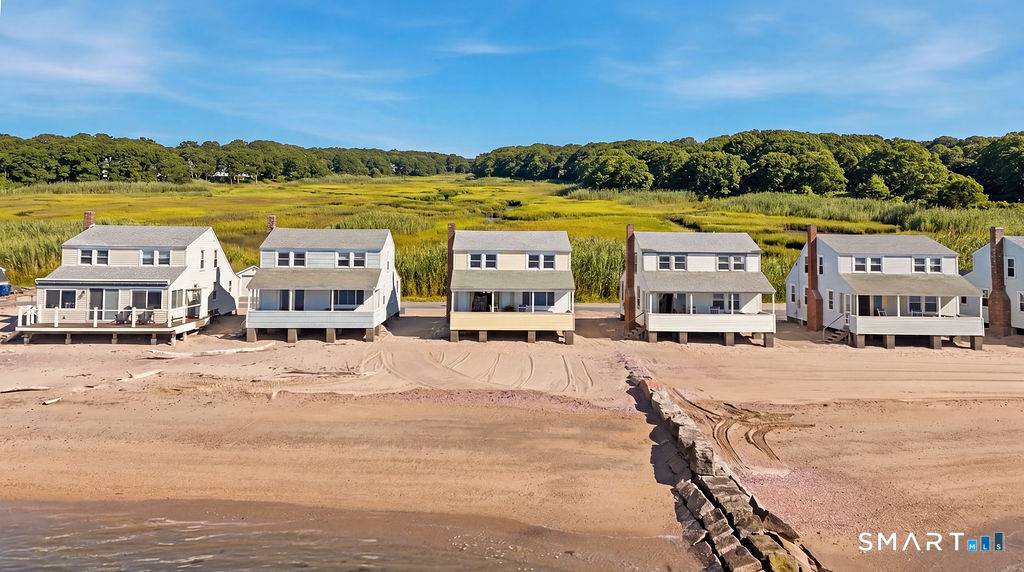 Charming direct waterfront beach cottage in sought after Hawk's Nest Beach, where life slows down and every day feels like a vacation.