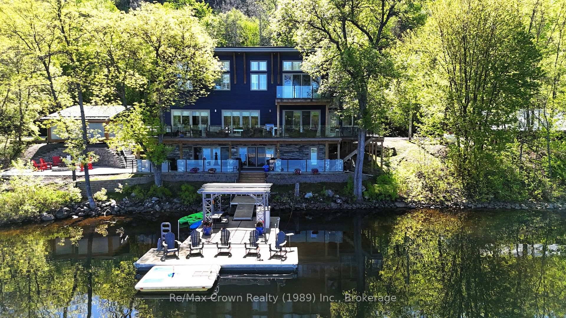 Welcome to lakeside elegance in this custom executive class 5 bedroom, 4 bath waterfront home offering over 4, 000 sq.