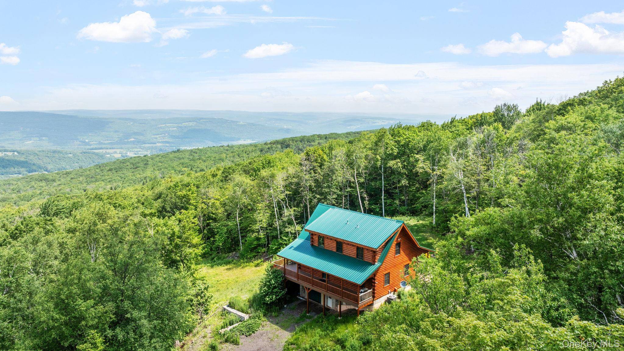 Modern Log Chalet on 22 Private Acres 10 minutes to Windham Beautiful custom built log chalet, set on 22 secluded acres with panoramic mountain views.