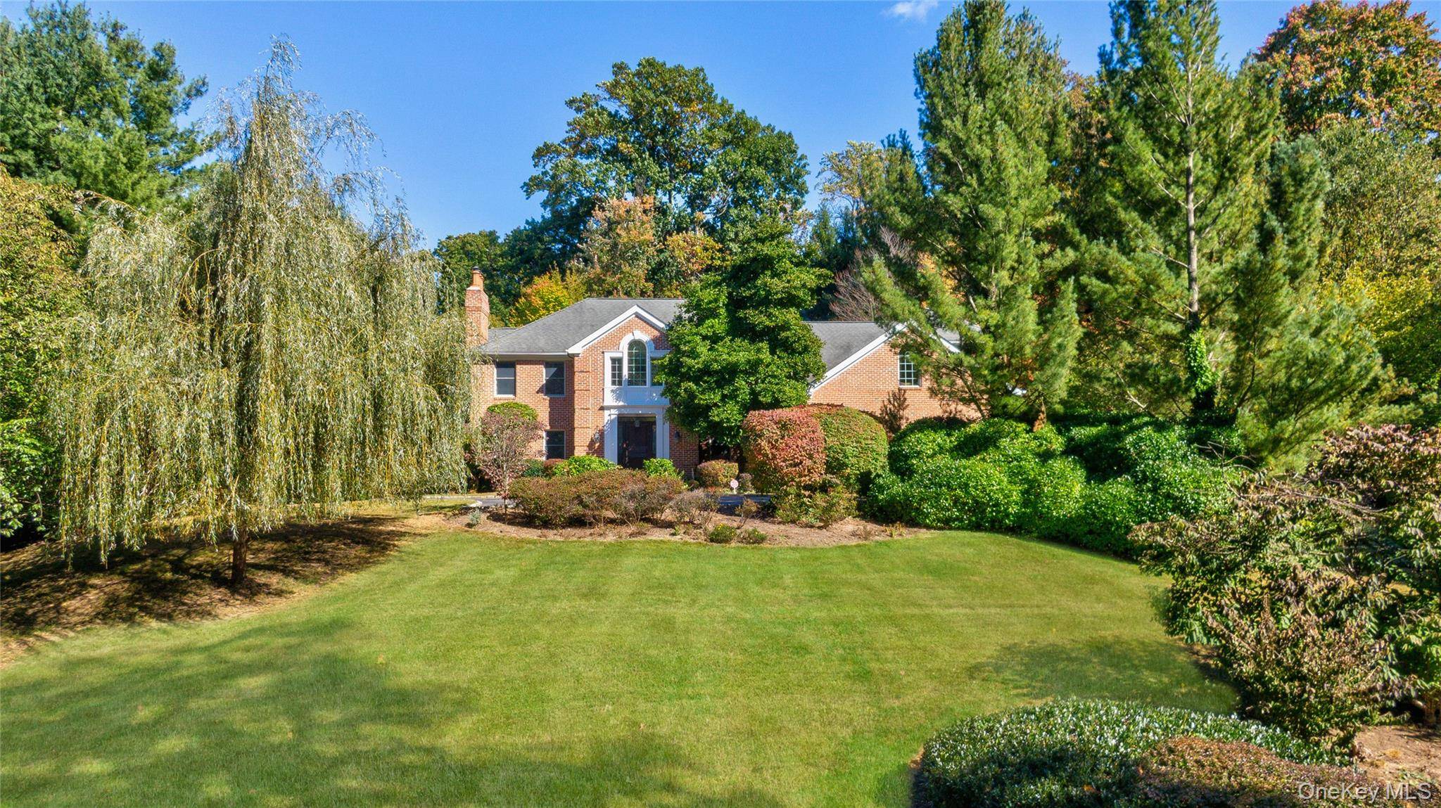 Exquisite custom built Center Hall Colonial in the prestigious Harriman Estates section of Sands Point.