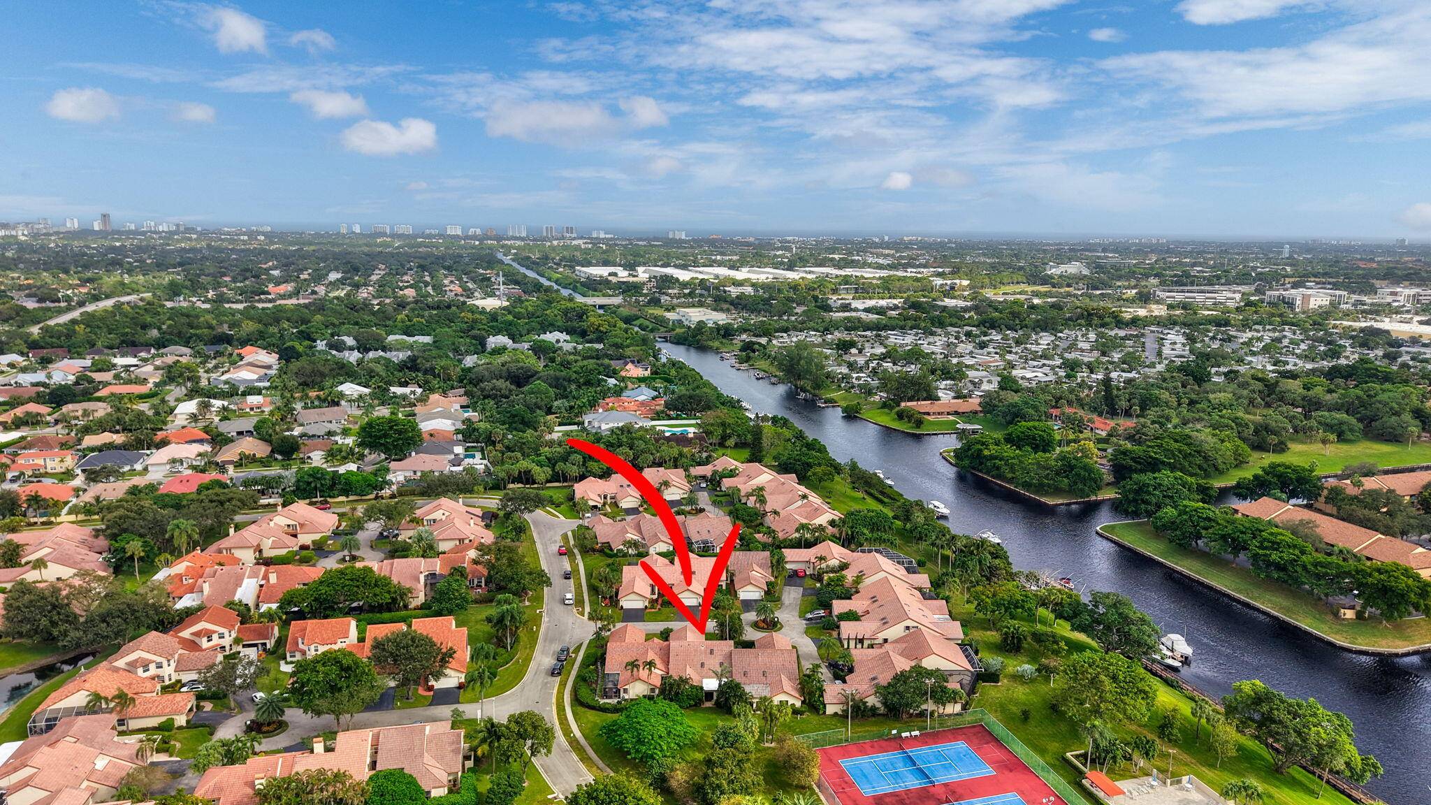 PRICE IMPROVEMENT Enhance your lifestyle at Waterside at Boca Trail, a stunning gated waterfront community in the HEART OF BOCA RATON.