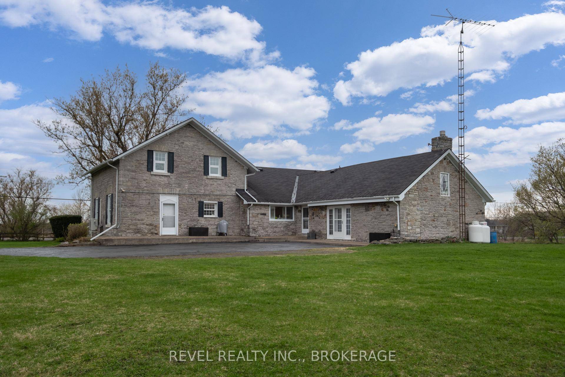 Welcome to 2964 Highway 38, a breathtaking limestone century home set on 30 picturesque acres, just 7 minutes from Kingston.