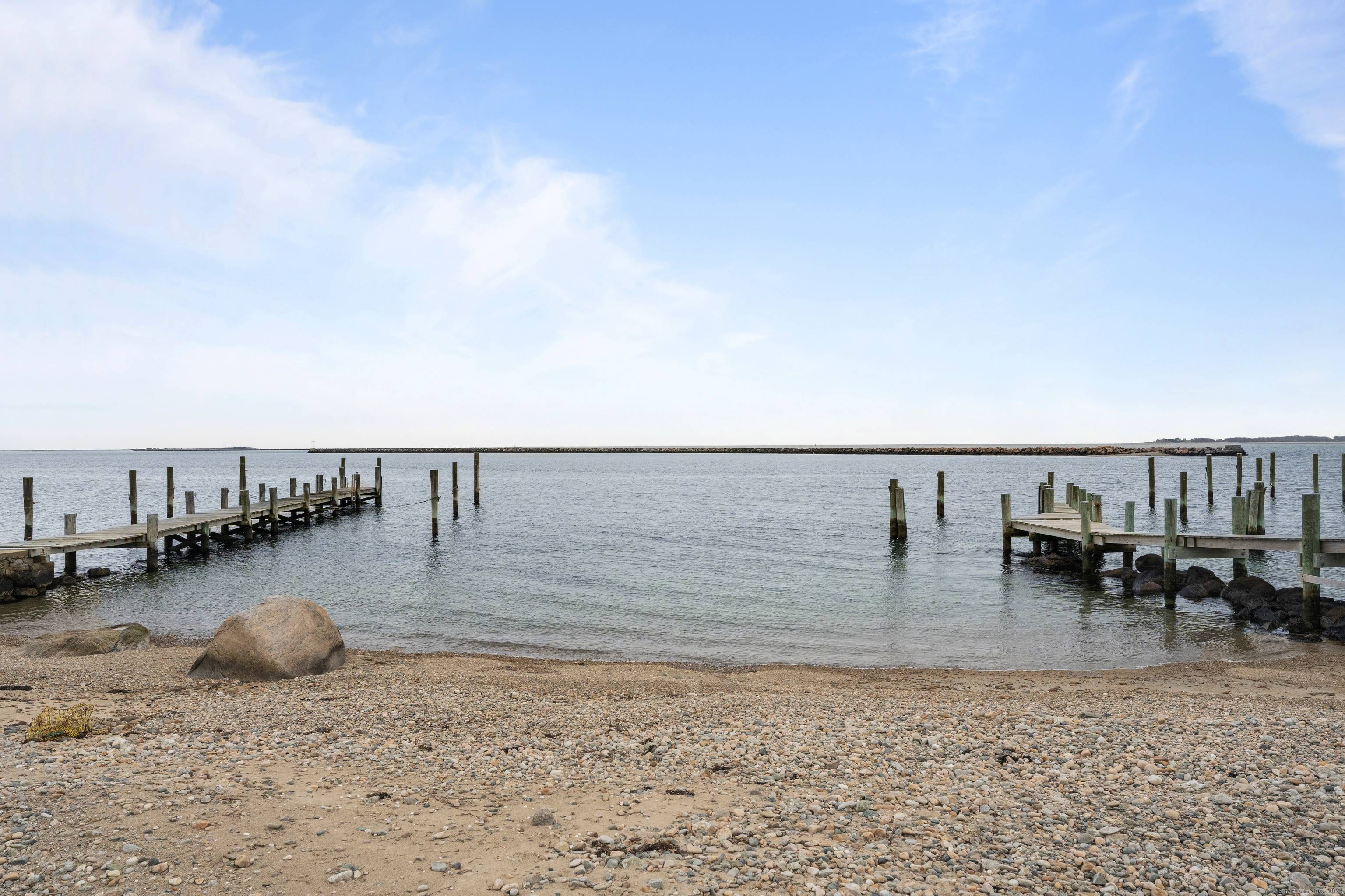 Located on Wamphassuc Point this is an incredible opportunity to own a stunning property with access to a deep water dock, private beach area and tri state water views out ...