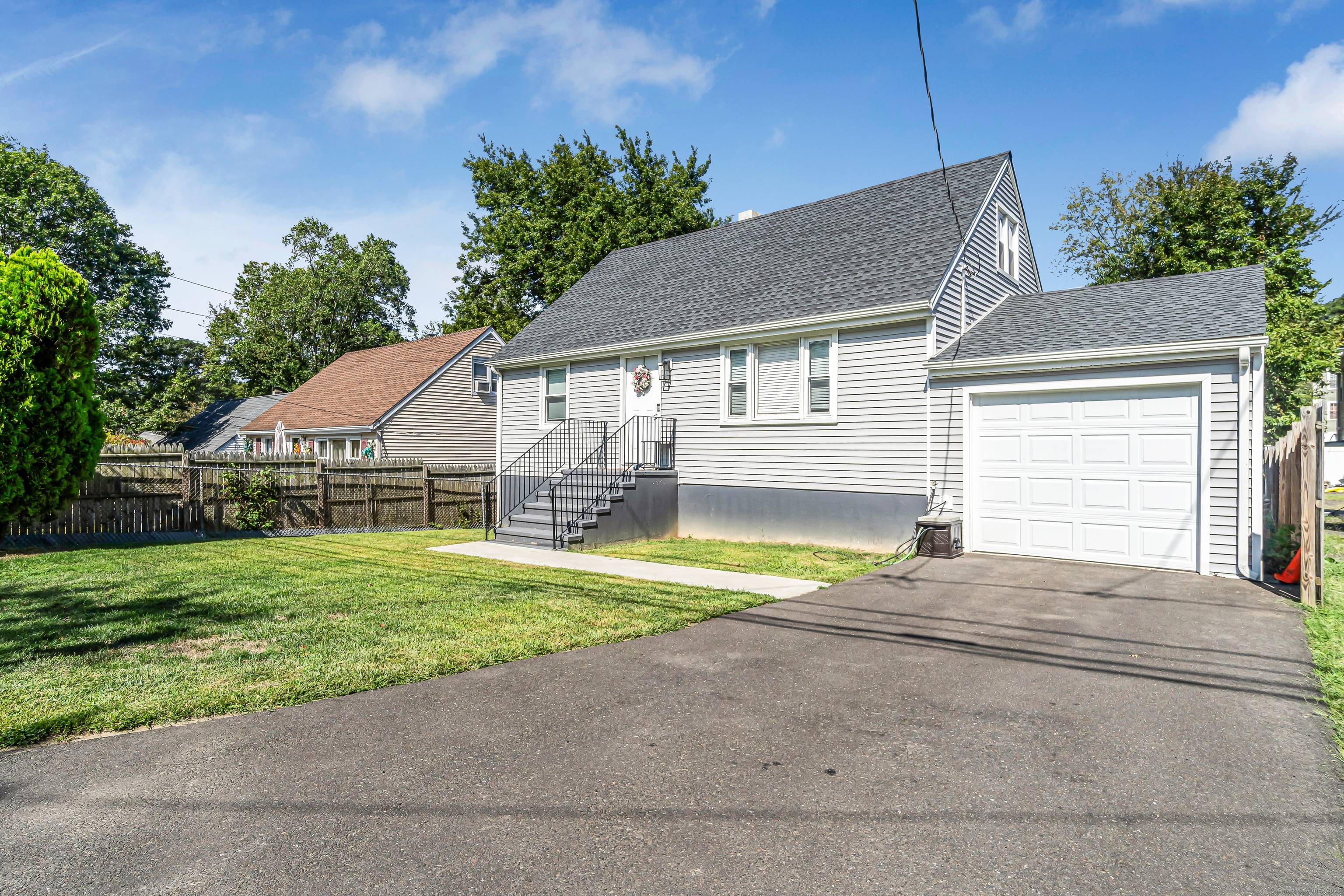 This exceptional Cape Cod style home combines classic charm with a modern flair.