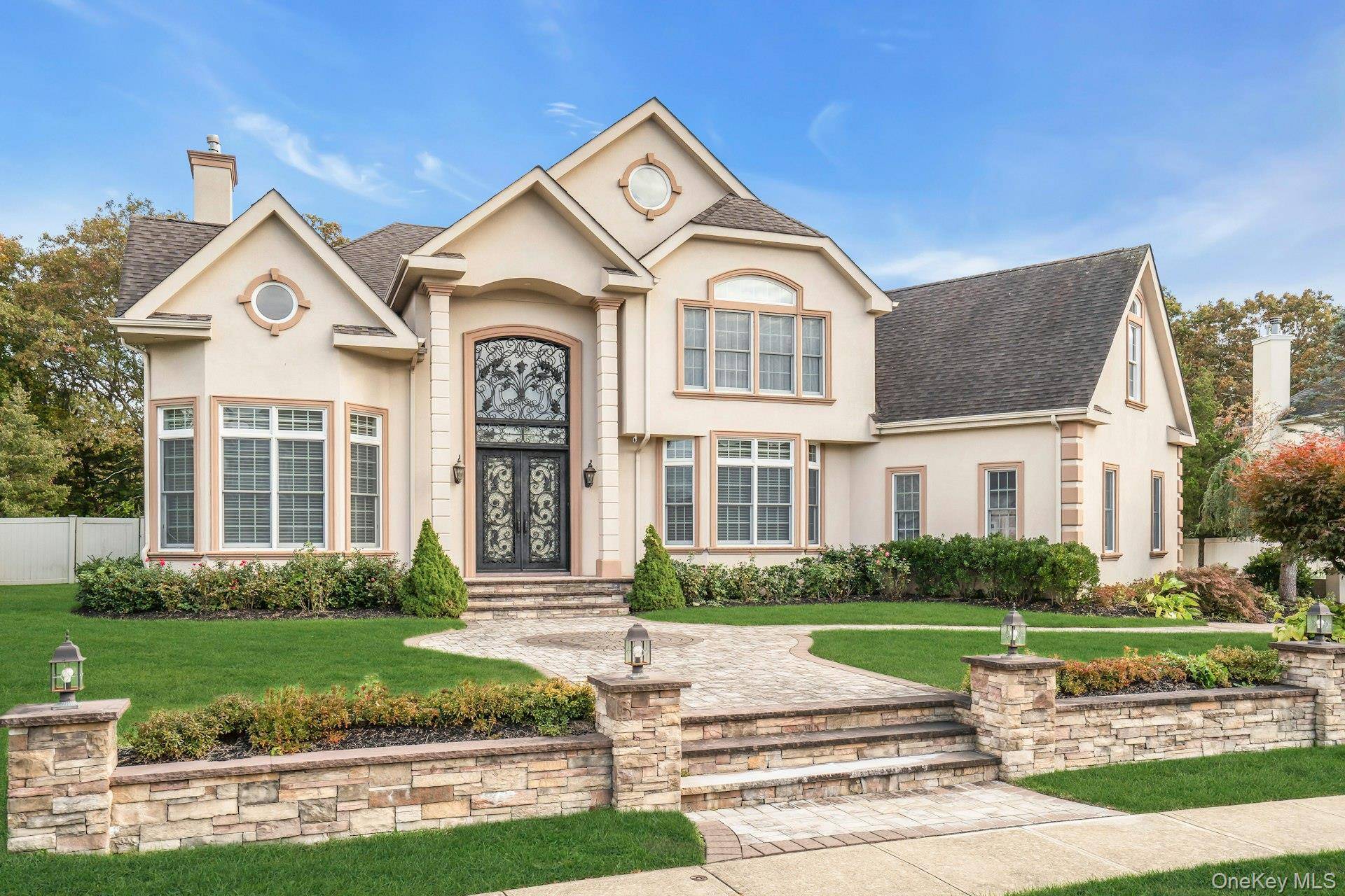 Welcome to 108 Fig Drive, a Diamond Colonial residence set within the prestigious gated community of Country Pointe at Dix Hills.