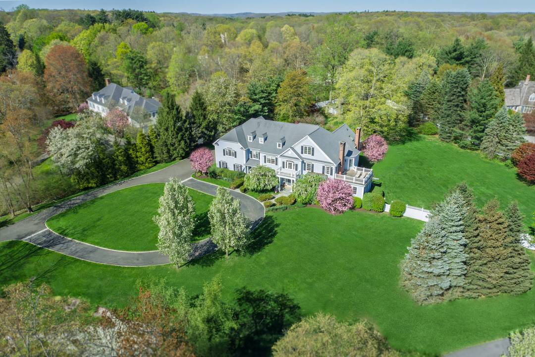Elegantly situated in one of Fairfield County's most desirable scenic roads, this timeless Estate offers luxury and privacy on 2 acres of spectacular park like grounds.