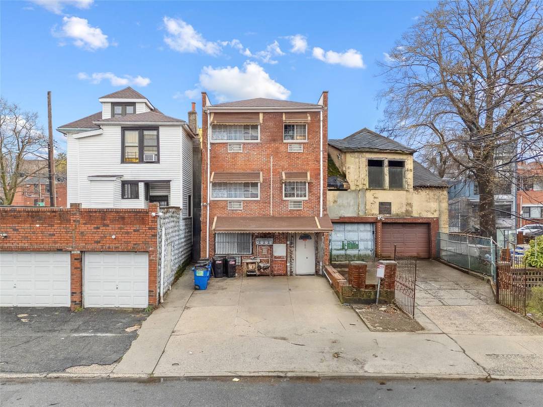 Turn Key 3 Family Brick Home in Bronxwood with Development Potential !