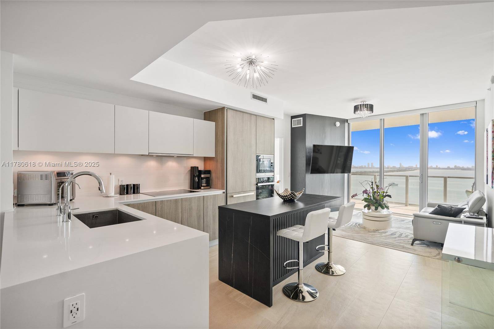 This stunning 2 bedroom, 3 bathroom condo with a den features luxury upgrades like a UV light system, 3M water filter, and Roberto Cavalli wallpaper.