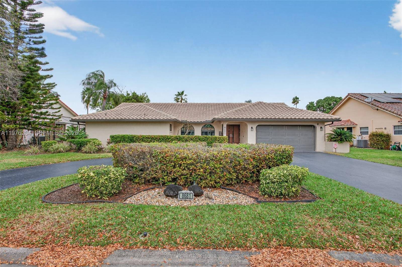 This luxurious, upgraded home in Pine Ridge is a must see, one of the nicest homes in Coral Springs.