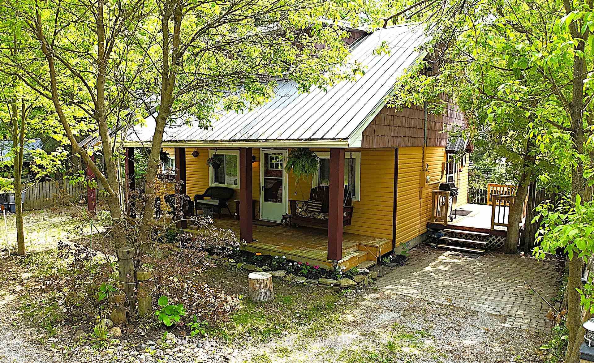 Here's the one ! This adorable year round home in the vibrant community of Balm Beach, just steps from the beautiful sandy shores of Georgian Bay.