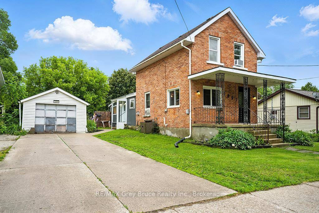 Excellent East side 1. 5 story home with detached garage and a 185 foot deep lot.