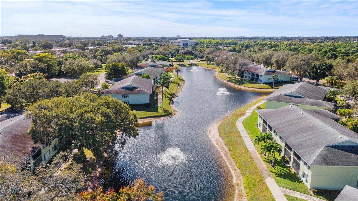 This is a stunning 2 bedroom, 2 bathroom, 1, 200 square foot, second story unit with a screen enclosed balcony overlooking a scenic lake and fountain.