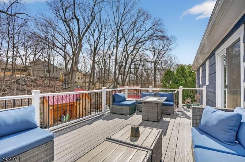 Welcome to Bloomingdale, New Jersey where comfort, space, and a connection to nature come together in this beautifully maintained three bedroom bi level home.