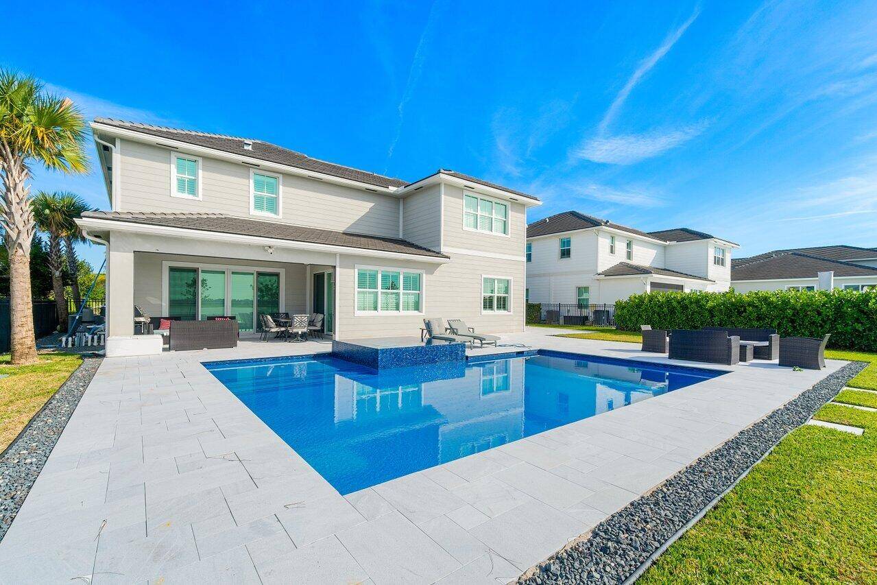Step into one of Arden's most exceptional estate homes, set on the largest lot in the community with panoramic lake views and a new, resort style heated pool.