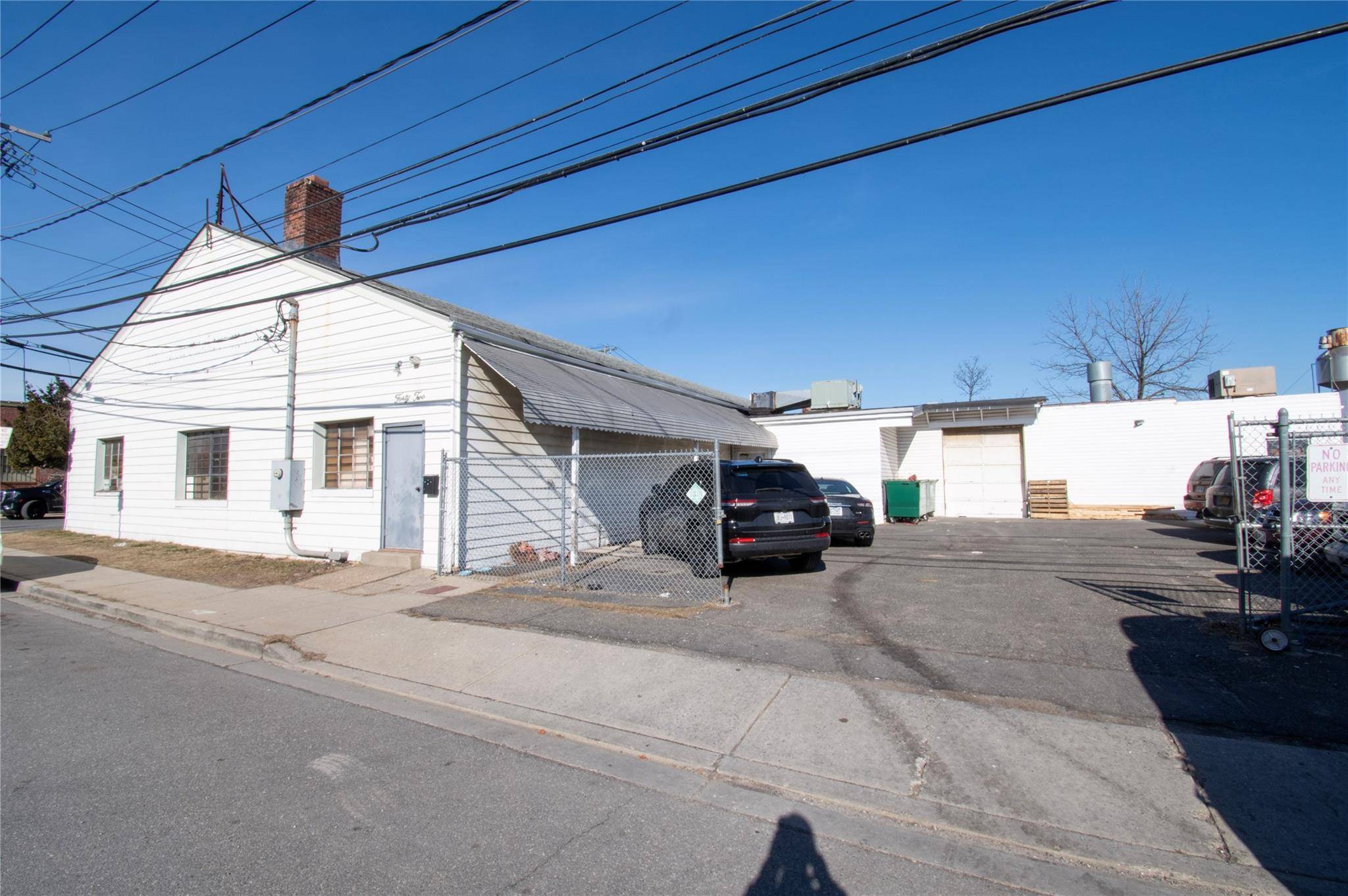 Warehouse manufacturing site For Sale on the corner of a unique street in the established neighborhood of Hempstead, Long Island.