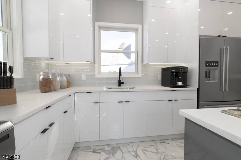 Welcome to this custom Colonial, completely renovated to feel like brand new construction, offering exceptional space and functionality across every level.