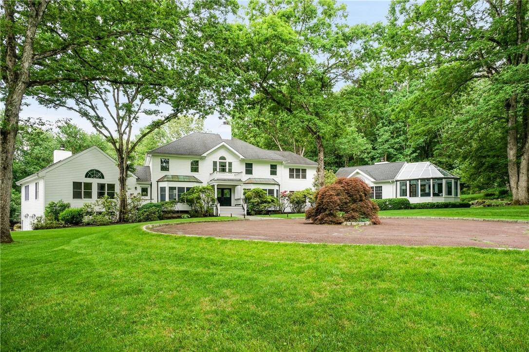 Prime Bedford gated estate on over 15 glorious acres of open, level land with spectacular age old specimen trees.
