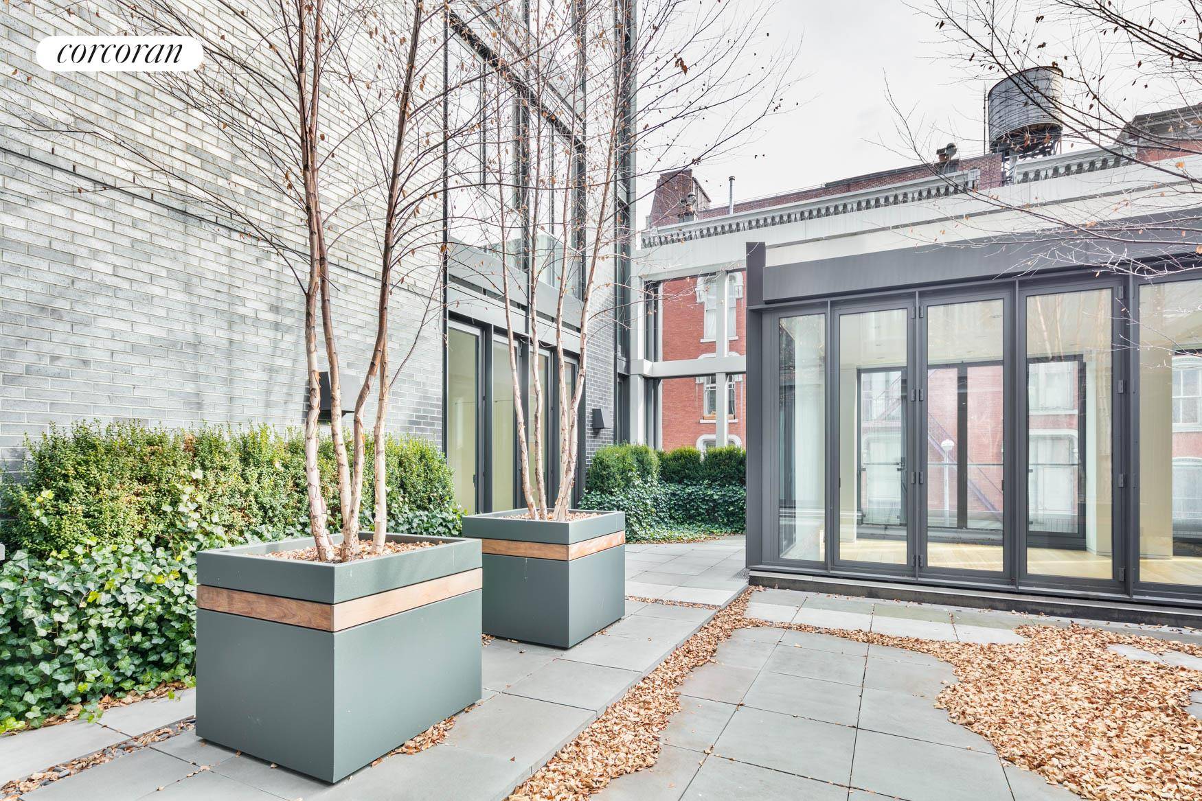 Enjoy remarkable indoor outdoor living in this impeccable three bedroom, three and a half bathroom designer showplace in a fantastic SoHo condominium building.