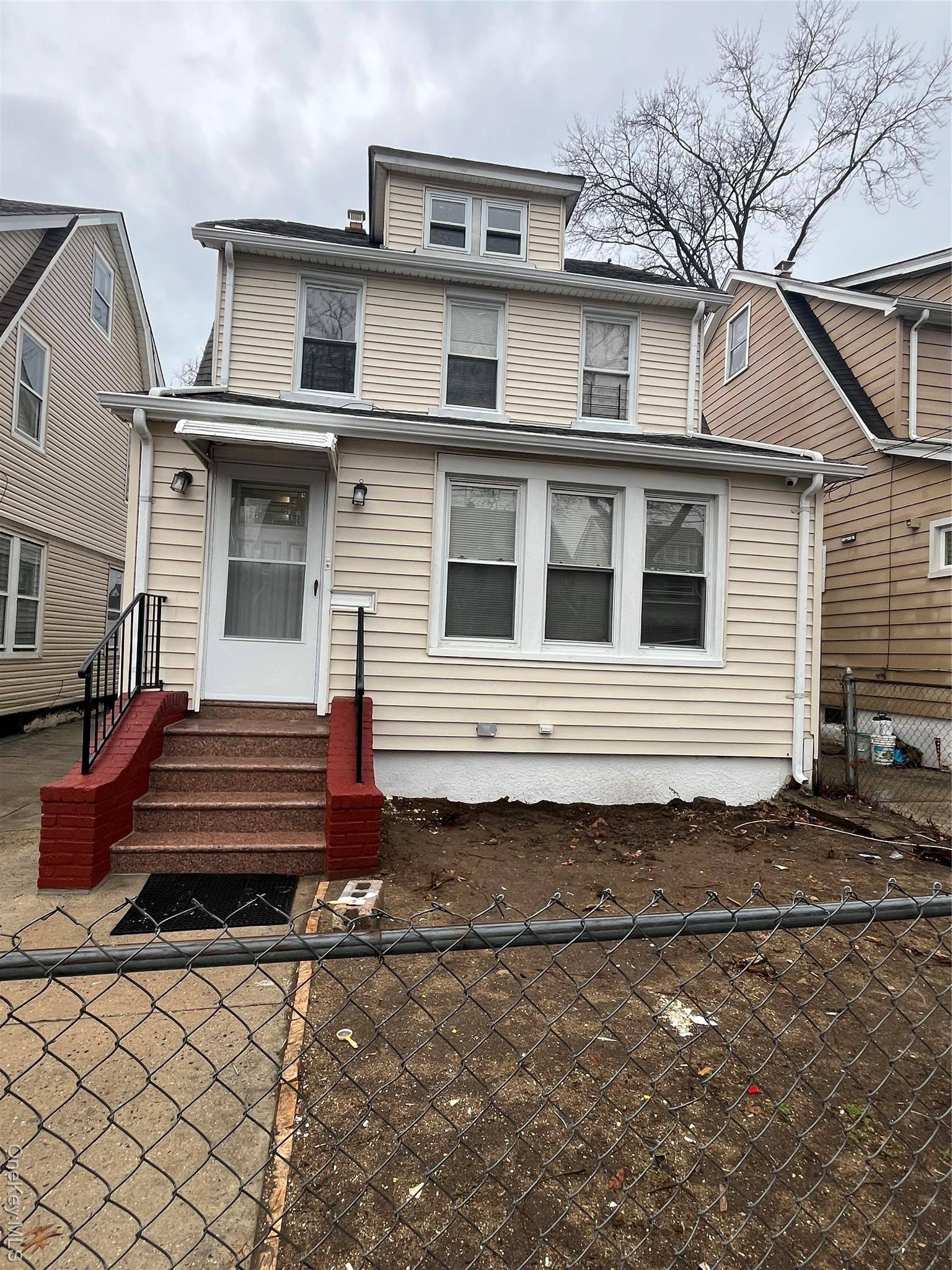 This newly renovated duplex home in Queens Village is used as a 2 family.