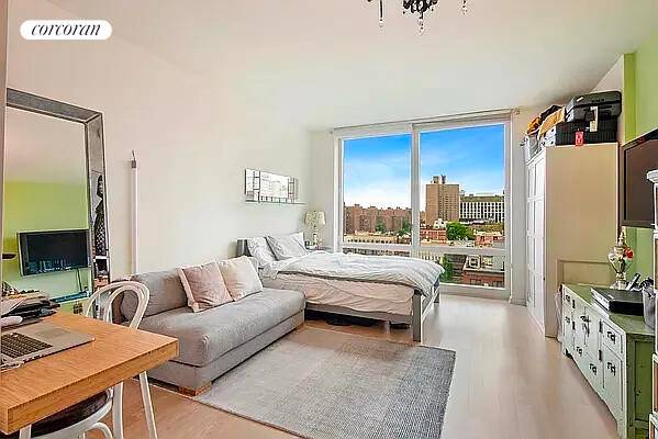 This spacious studio apartment features floor to ceiling windows that accentuate the open, south facing views.