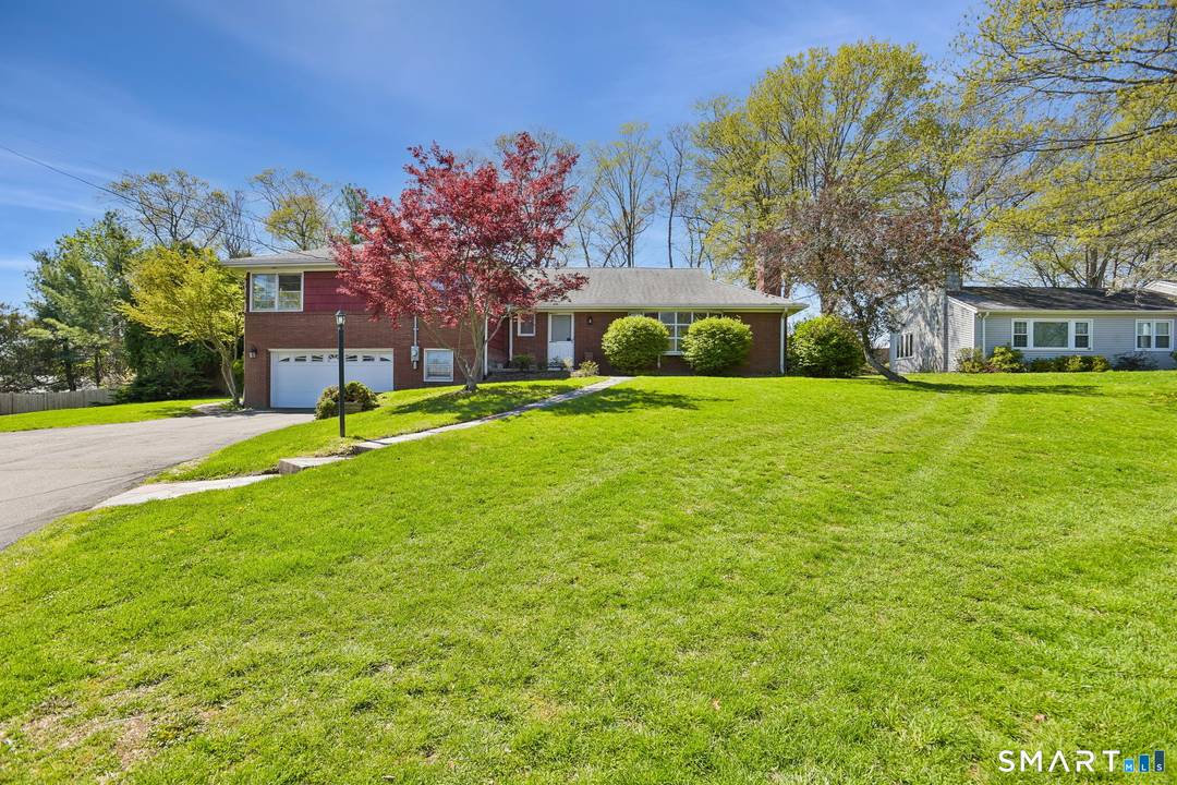 This upper Westville brick split level home offers large, sunny spaces and a great mid century vibe.
