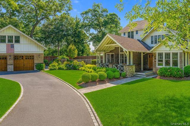 Stunning, fully renovated home featuring dramatic foyer entrance, great room w soaring ceiling and french doors that open to a private backyard with an inground salt water pool and lush ...