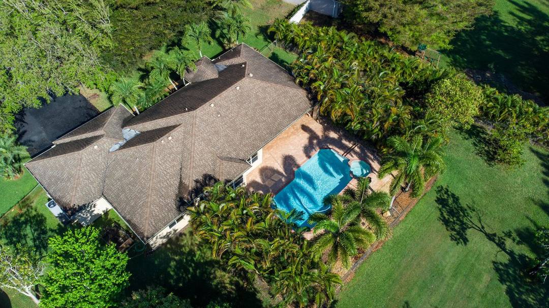 Beautifully maintained four bedroom pool home perfectly located in a very diserable area of Pembroke Pines sitting on a builder's acre.