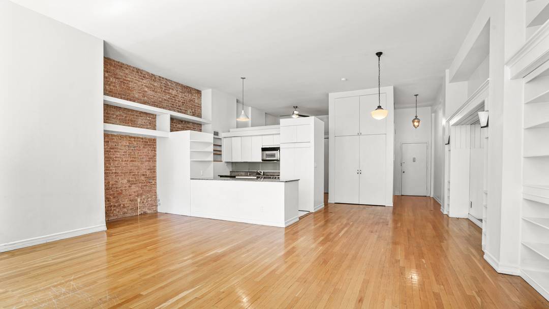 Experience authentic loft living in this rarely available, sun drenched south facing convertible one bedroom loft residence featuring soaring 13'4 foot ceilings, exposed brick walls, oversized industrial style windows, and ...