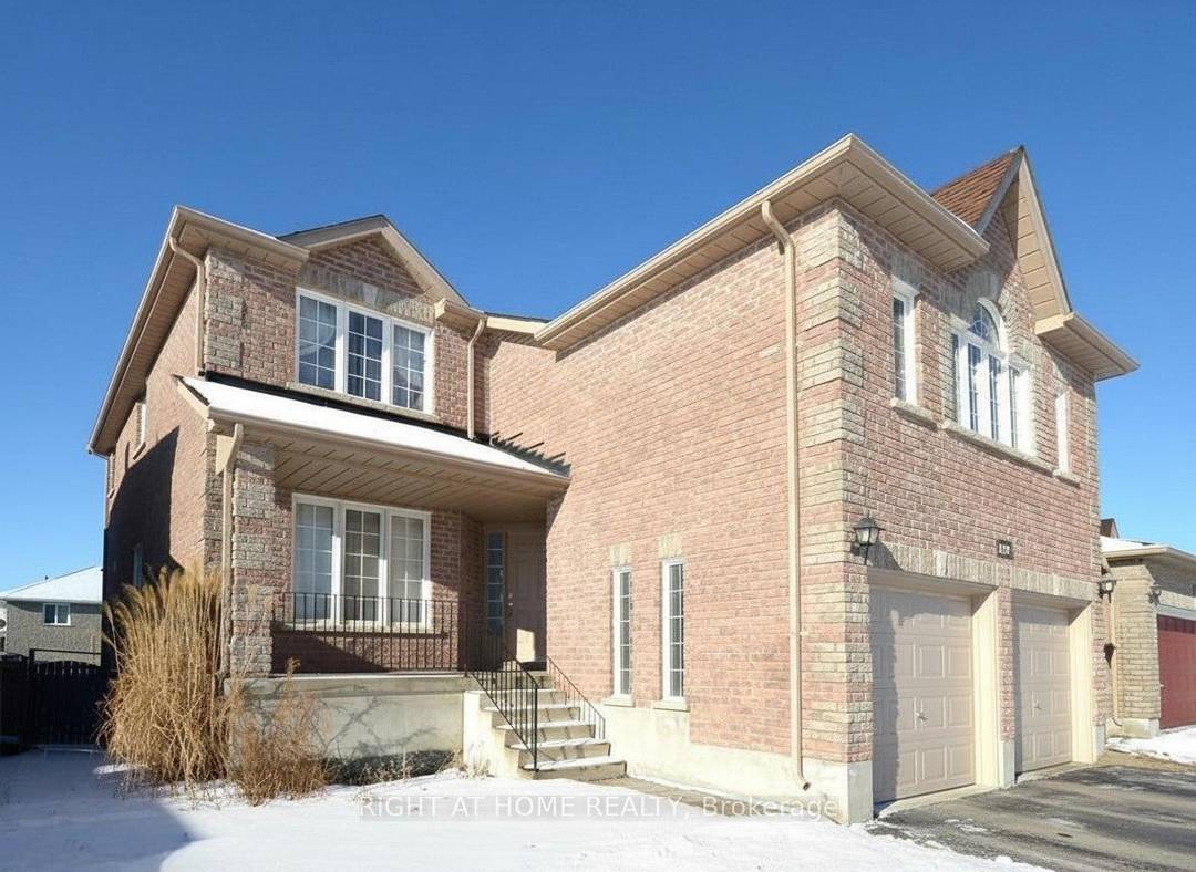 Bright and spacious 4 bedroom, 2 bath upper level apartment for rent in South East Barrie, featuring a cozy living room with gas fireplace, ensuite laundry, and 2 parking spots.