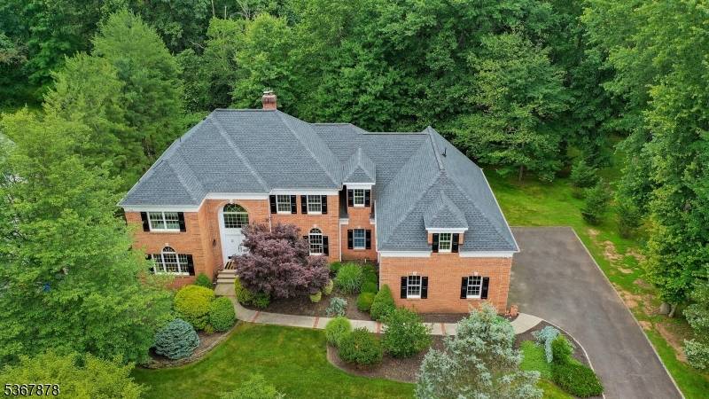 Classic Charm Meets Modern Elegance in This Brick Colonial Gem !