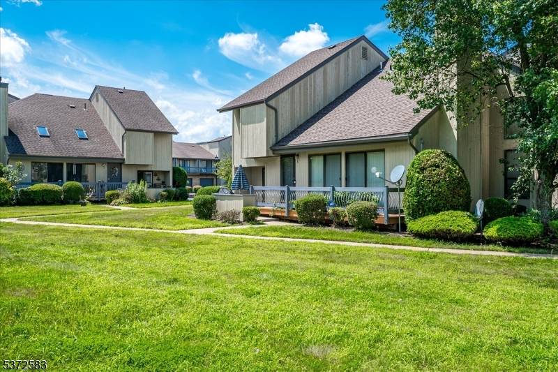 Whitehall Manor is where you will find this contemporary end unit townhome with an open floor plan design offers cathederal ceilings, eat in kitchen with stainless appliances, hardwood floors in ...