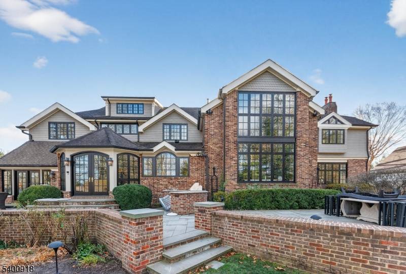 Experience resort style living in this exceptional North Caldwell residence, where timeless craftsmanship meets modern luxury.