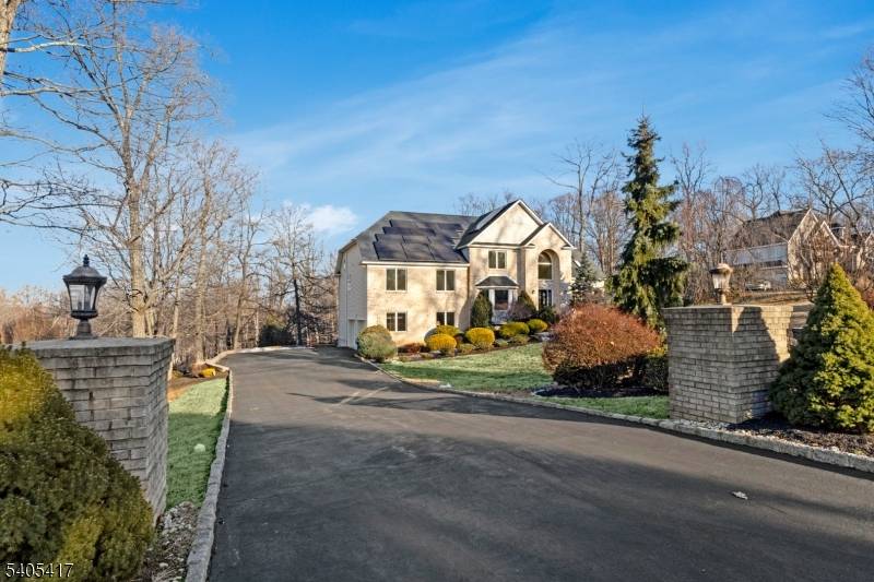 Set atop the highly sought after Martinsville mountaintop section, this exceptional custom built brick home offers privacy, elegance, and breathtaking views on 1.