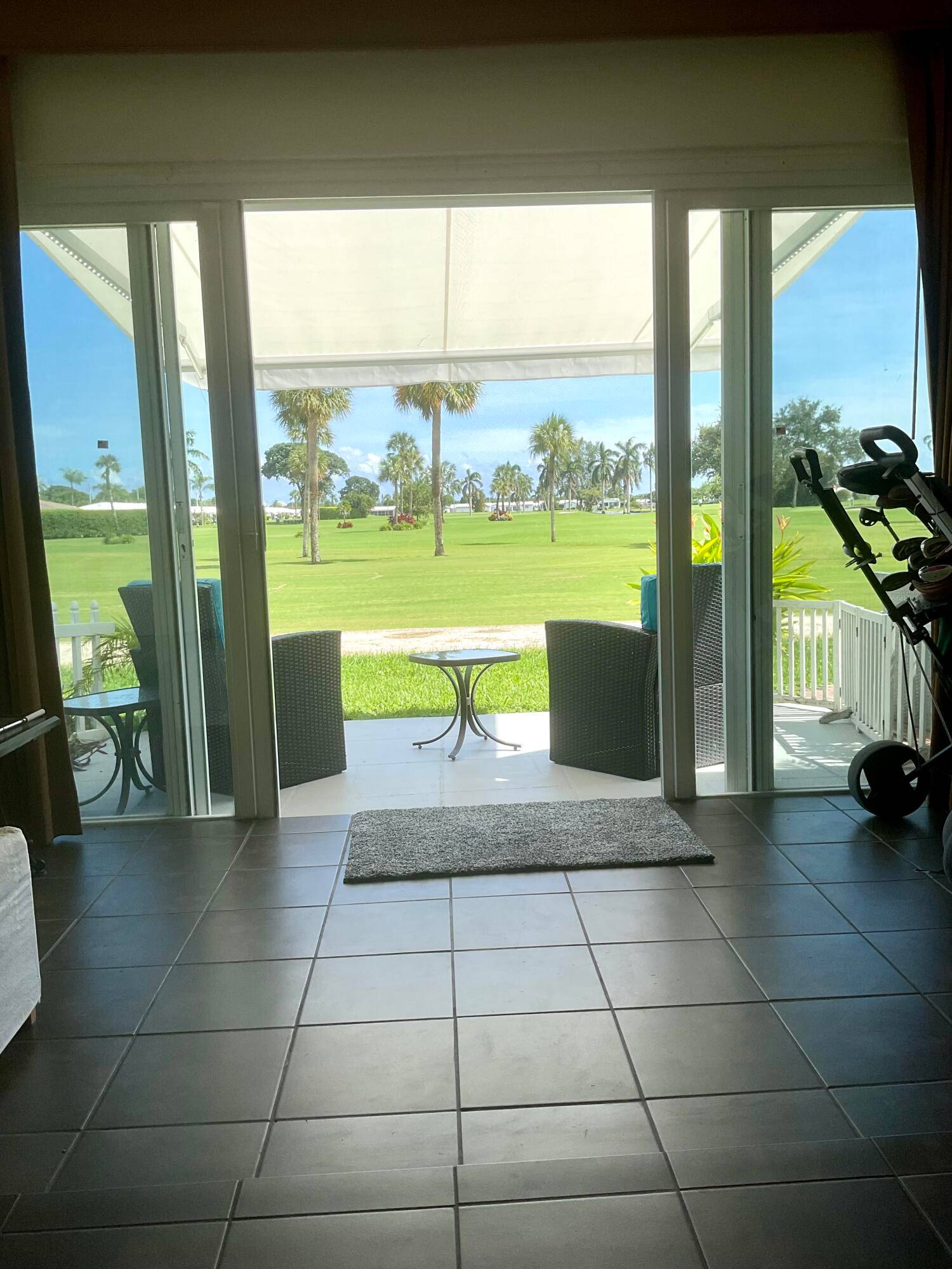 Corner villa with panoramic views of the golf course and lake on the 18th hole.