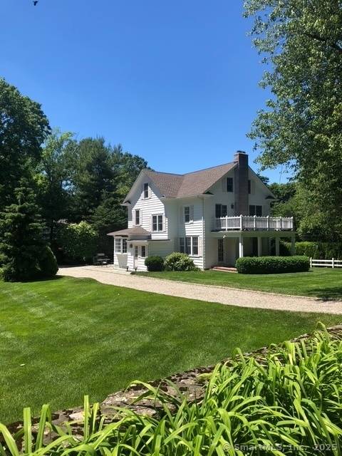 Nestled down on one of Darien's most sought after streets, this charming farmhouse offers five bedrooms, three full one half bath, and lots of privacy.