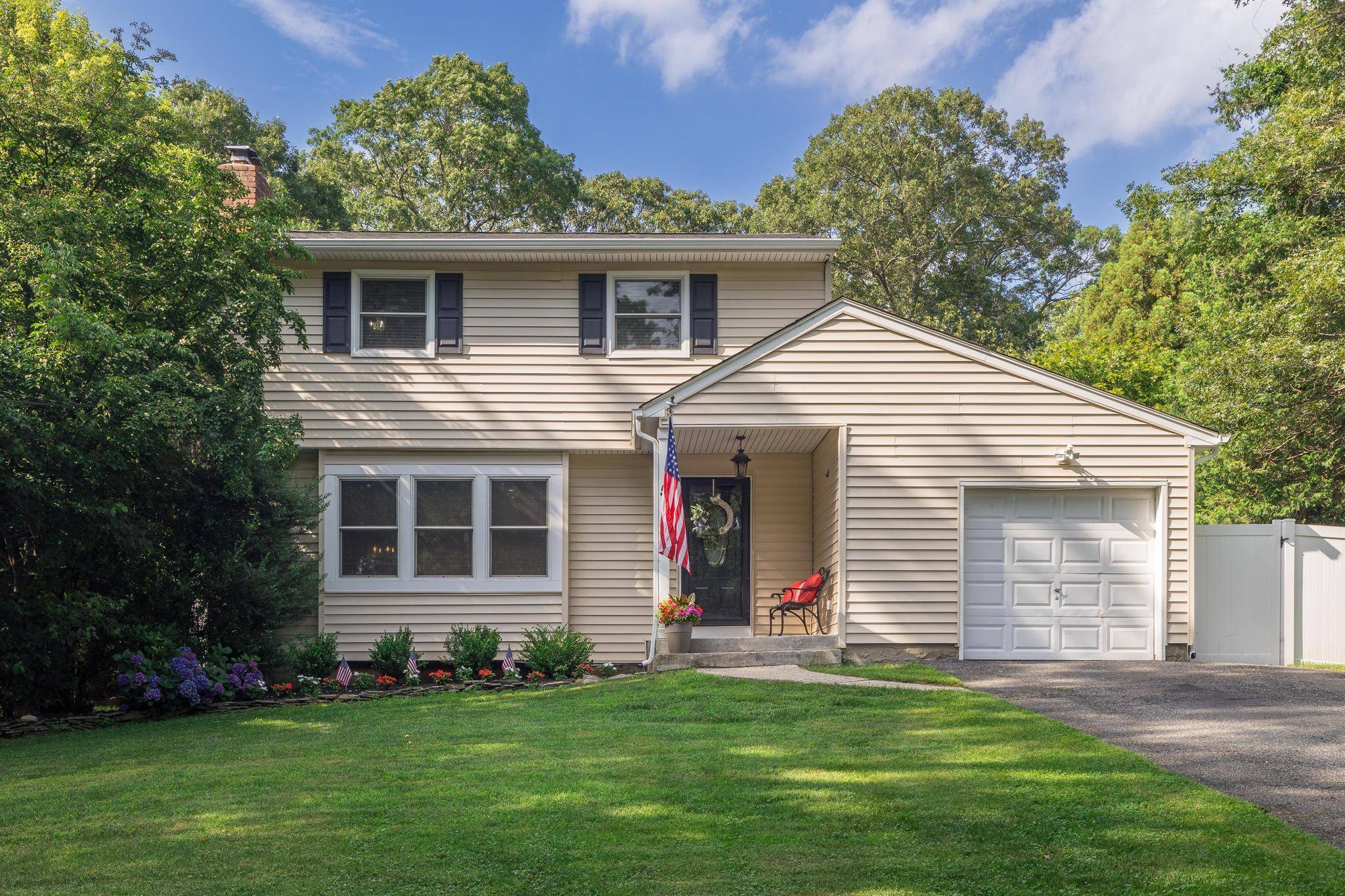 Welcome Home to this stunning 3 bedroom, 2 bath gem on a serene oversized half acre lot.