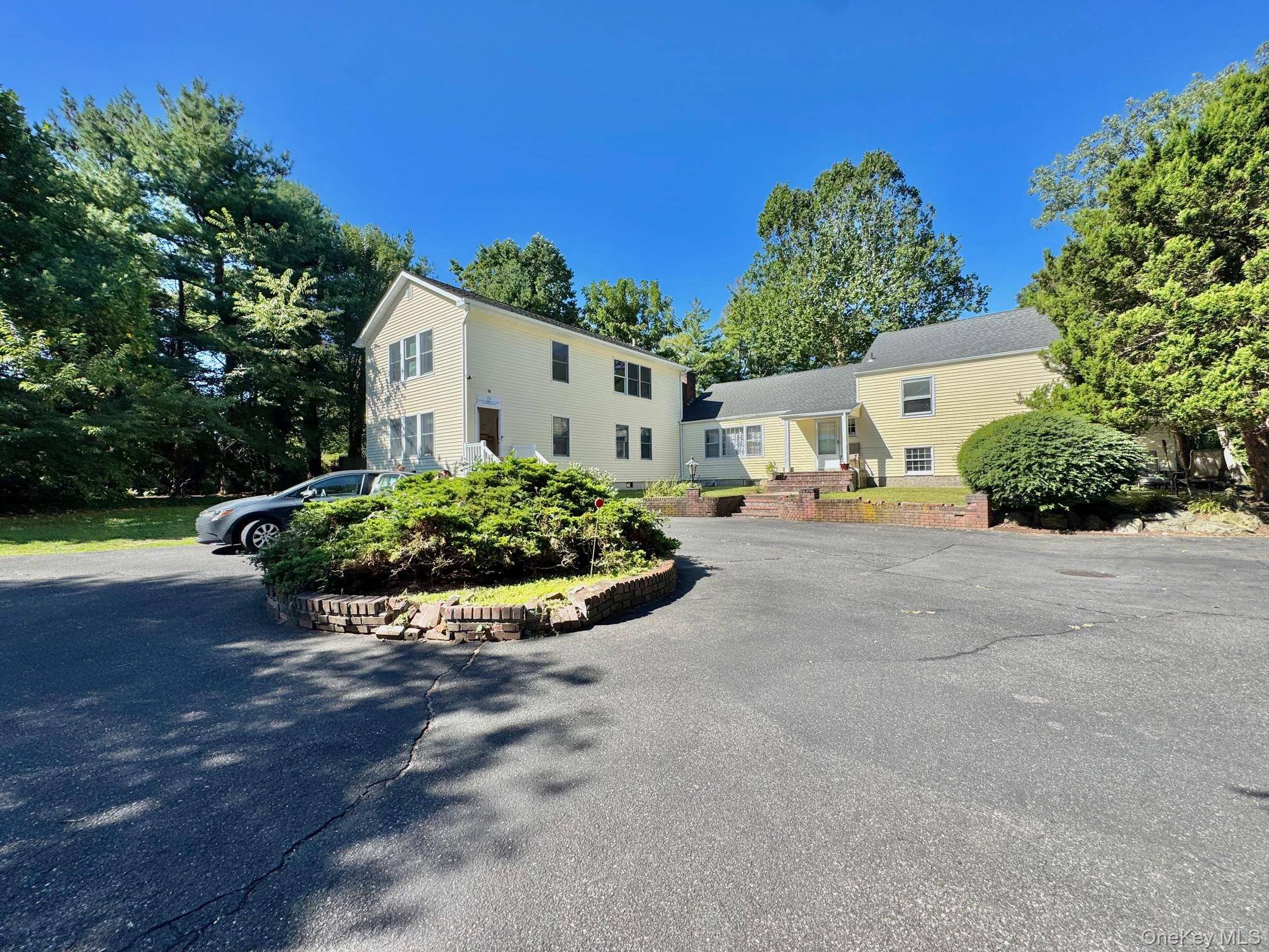 The Property Features Excellent Signage, Great Exposure, High 8 Ceilings, R40 Zoning, 32 Parking Spaces, 2 Car Garage, Skylight, 2 Bay Warehouse, Circular Driveway, 3 Br.