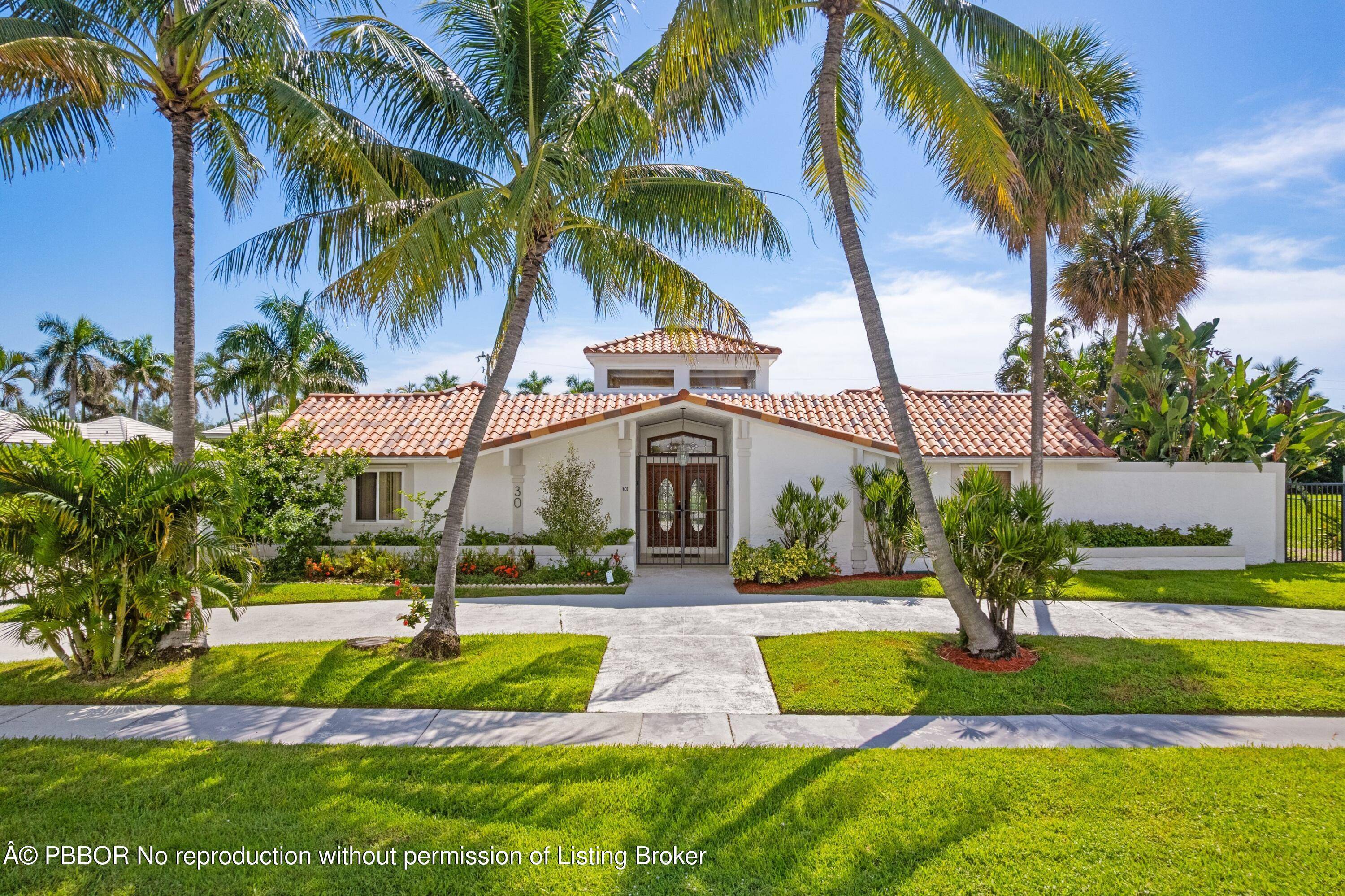 Located in the highly desirable Point Manalapan neighborhood, this prime property presents an exceptional opportunity to build your dream home on this expansive almost 1 4 acre lot or enjoy ...