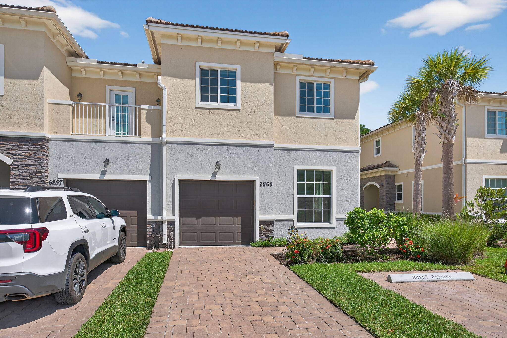 One owner 4BR 3BA end unit CBS townhome in gated Heritage Enclave, privately nestled on a preserve.