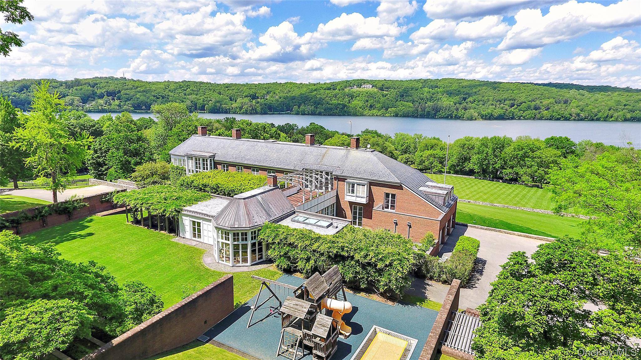 The spectacular Titicus Reservoir and over nine acres are the backdrop to this stunning architectural gem.