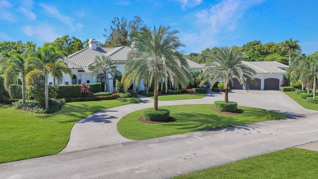 Experience refined luxury in this exceptional contemporary waterfront estate set on a full acre.