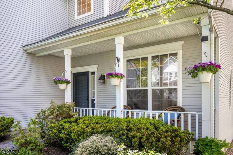 Nestled in the desirable Reservoir Ridge neighborhood, this beautifully updated Colonial style home is a peaceful retreat surrounded by nature.