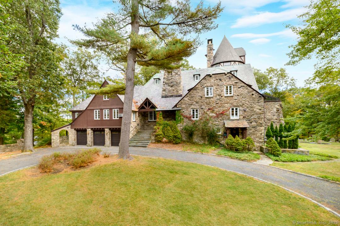 Chateau Rochamore a French Normandy stone manor of timeless grace sits on over three park like acres in North Stamford.