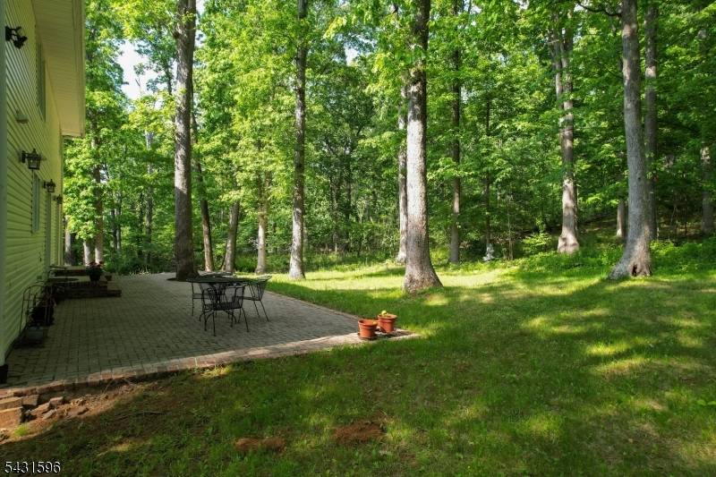 Perched atop a sprawling and private 1.