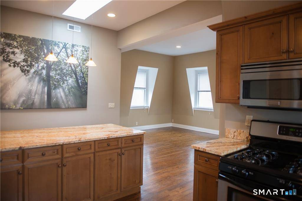 COMMUTERS DREAM ! !.. Stunning, Penthouse Condo with Water City Views on a beautiful deck !