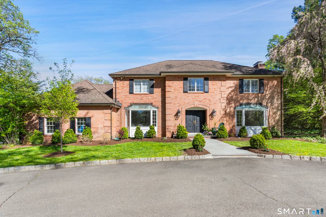 Set on 2. 77 manicured acres in North Stamford, 223 Jonathan Drive is a stately red brick colonial that seamlessly blends classic elegance with modern updates.