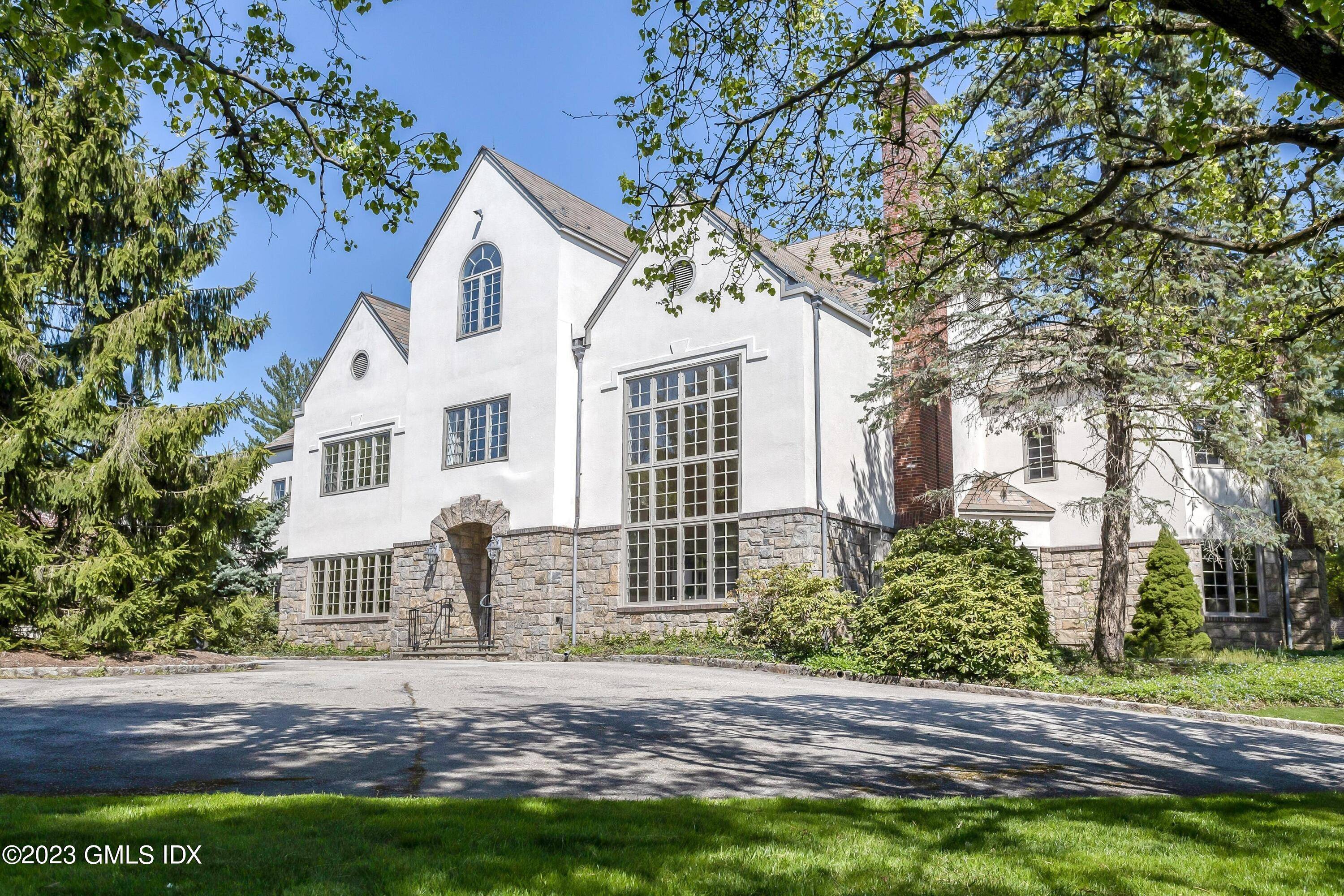 First time ever on the market, this beautifully sited stone and stucco home on 2.