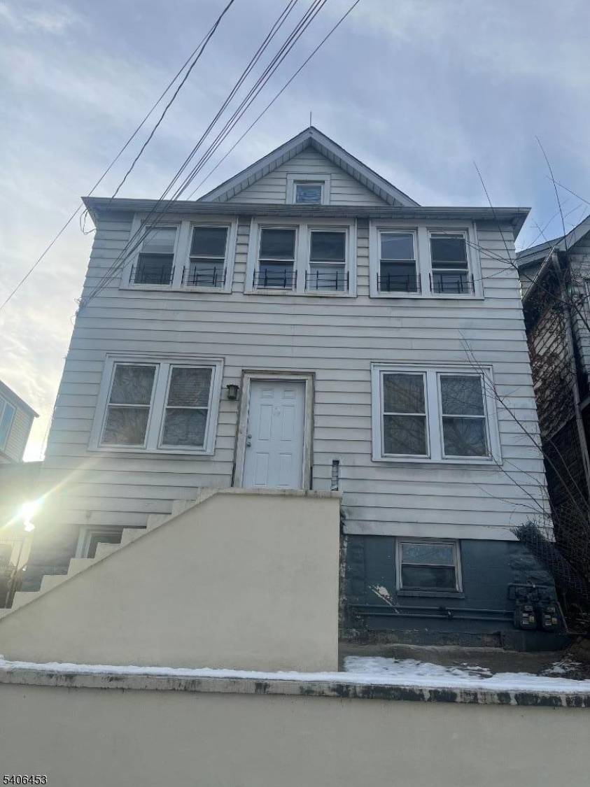 Income producing, move in ready, and recently renovated property featuring finished basement and attic, along with two detached parking spaces.